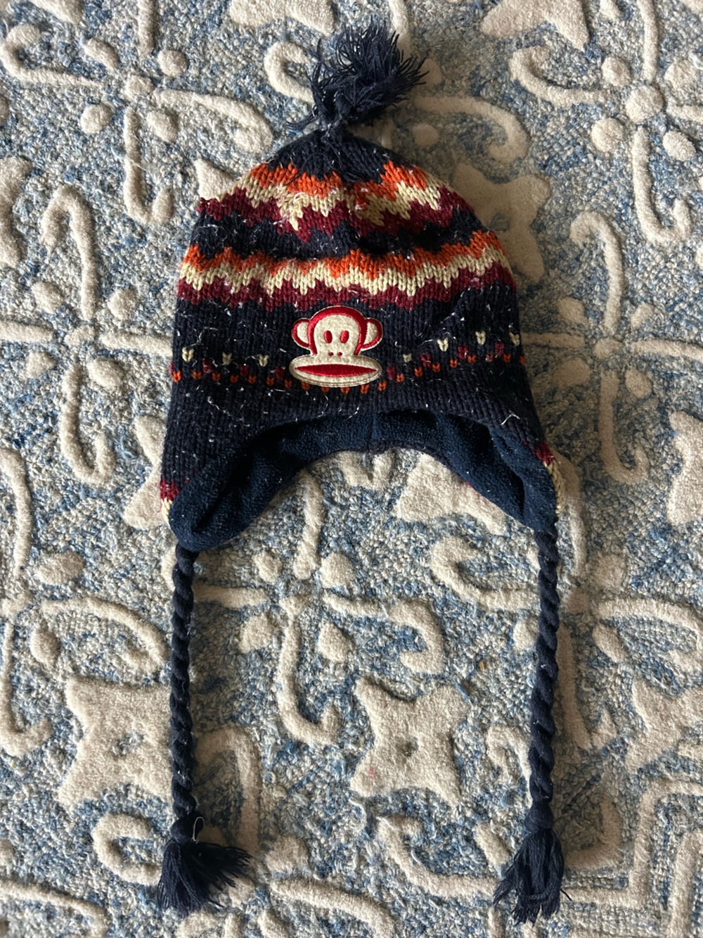 Navy Fair Isle Knit Earflap Hat with Red Monkey Patch- small hole in top